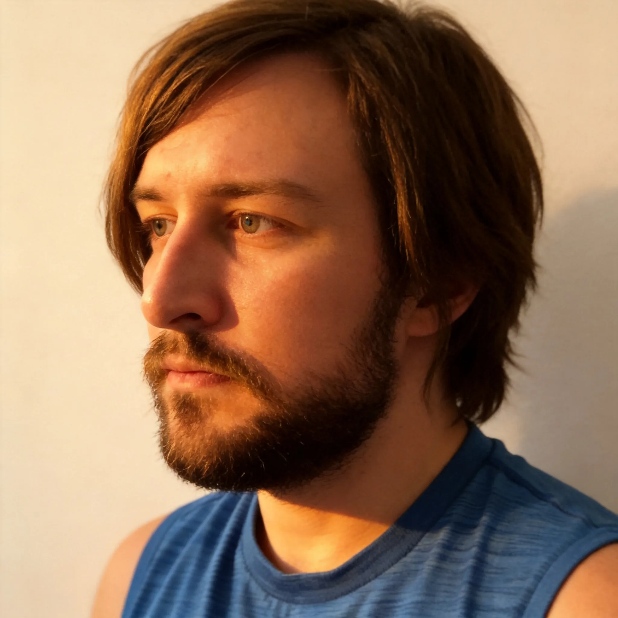 Make this face very well lit so it's more attractive. 
Make the lighting cozy and warm but also well lit up. Make it look like a fantastic profile picture.