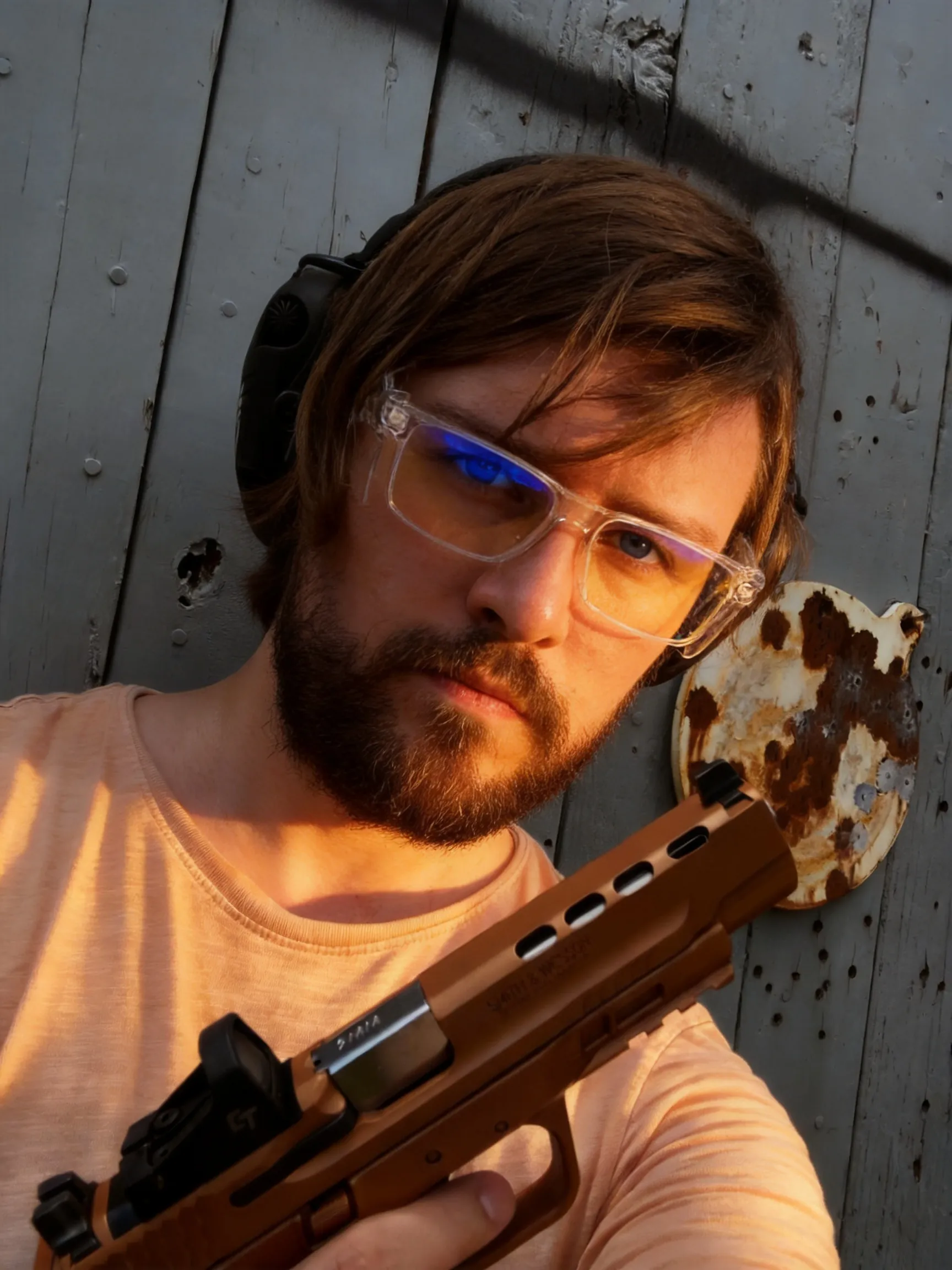 Make this the best profile picture ever. Make the lighting warm and cozy but not too extremely warm.  Make the lighting perfect. Make the angle epic and the face is in a very heroic pose. Make his eyes well lit so they are focal points on the image.