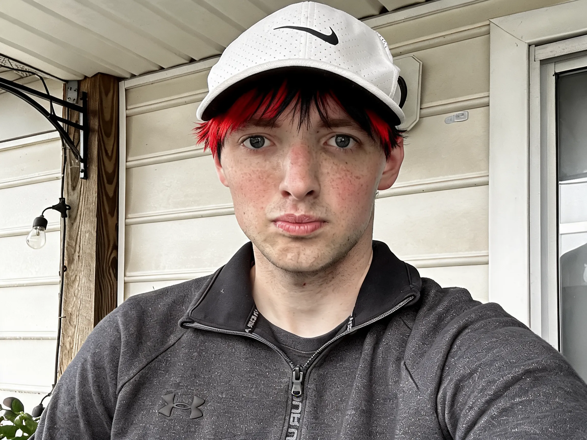 Change my hair color to red and black highlighted style.