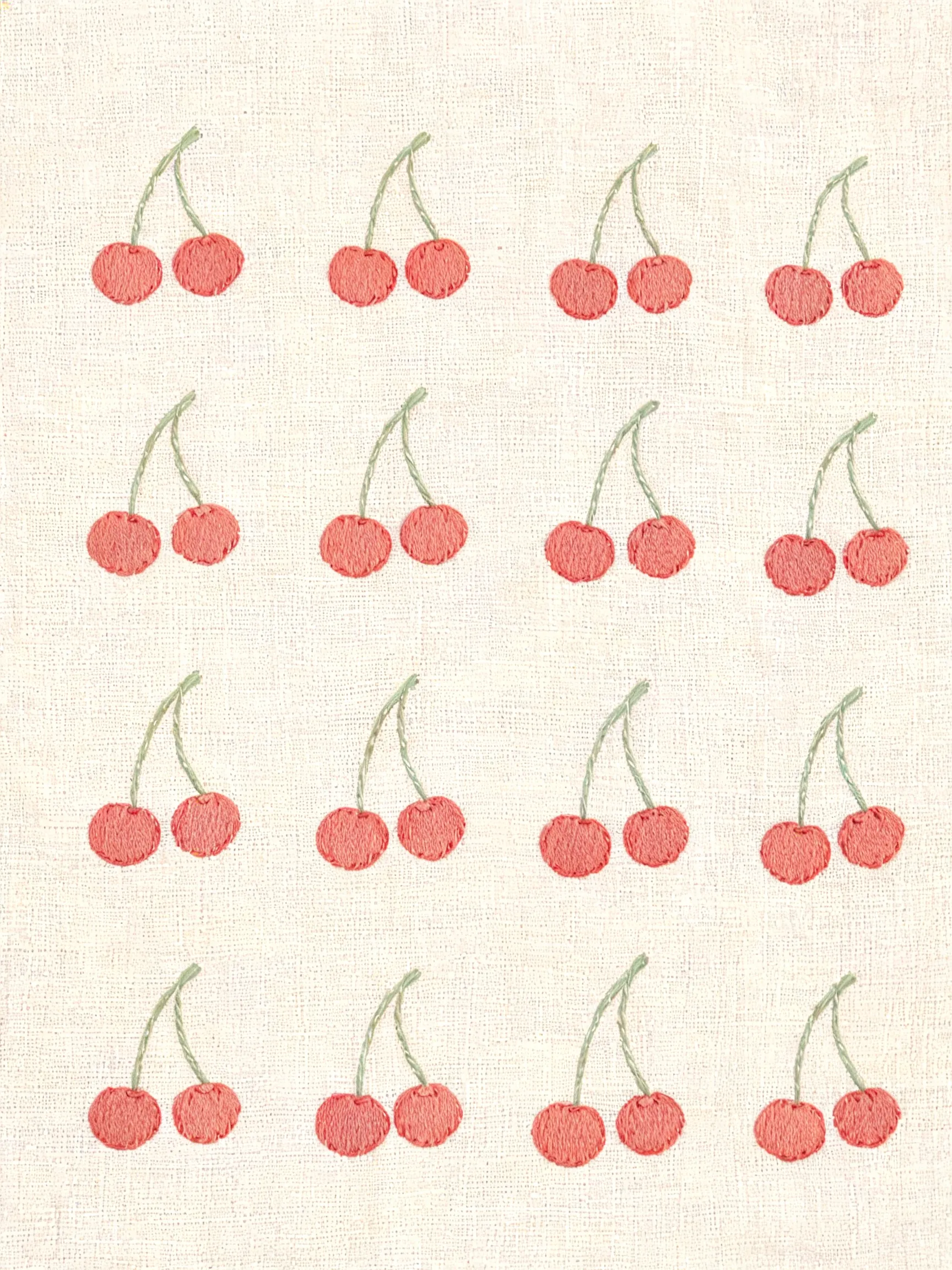 Flat embroidery pattern featuring geometric designs in the style of Mina Perhonen textiles. The core motif is a loose cherry matrix, resembling printed fabric. Soft natural tones centered on red color palette. The edges of the pattern carry subtle hand-drawn imperfections, laid over a delicate linen-textured background, conveying a warm, refined handmade texture. No text anywhere in the frame.