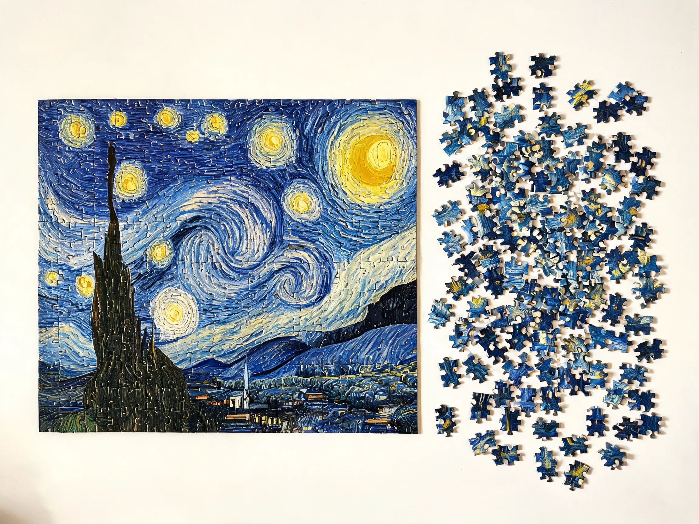 A partially completed jigsaw puzzle on a white table, showing Van Gogh's Starry Night. One half is fully assembled and perfectly matched, the other half is still scattered as loose puzzle pieces. Realistic photography style, overhead flat lay view, morning daylight, puzzle pieces with classic knob-and-hole cuts.