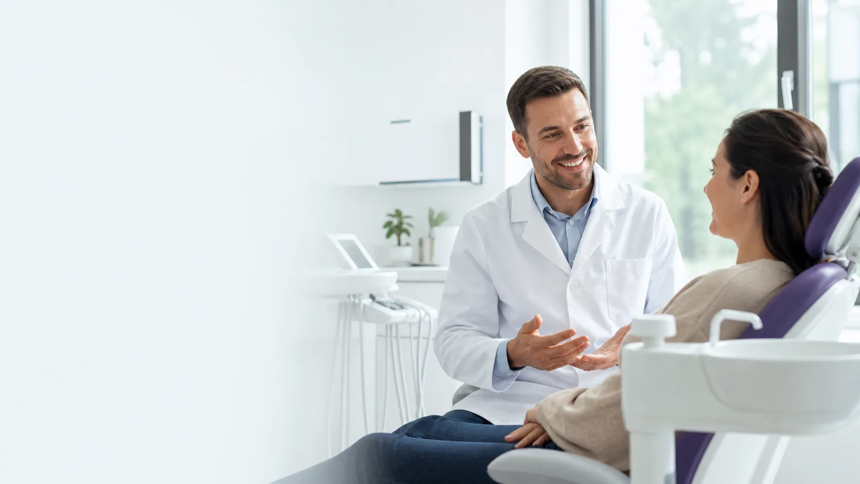 A realistic commercial photo for a local dental clinic website hero image, a friendly dentist speaking with an adult patient in a bright modern dental office, clean white interior, soft natural daylight, professional but approachable atmosphere, calm healthcare marketing style, copy space on the left side for website headline, suitable for a dental clinic homepage, no text, no logo, no watermark Negative prompt: scary dental tools, blood, surgery, awkward hands, distorted faces, fake stock photo look, overposed smile, blurry, low quality, text, logo, watermark