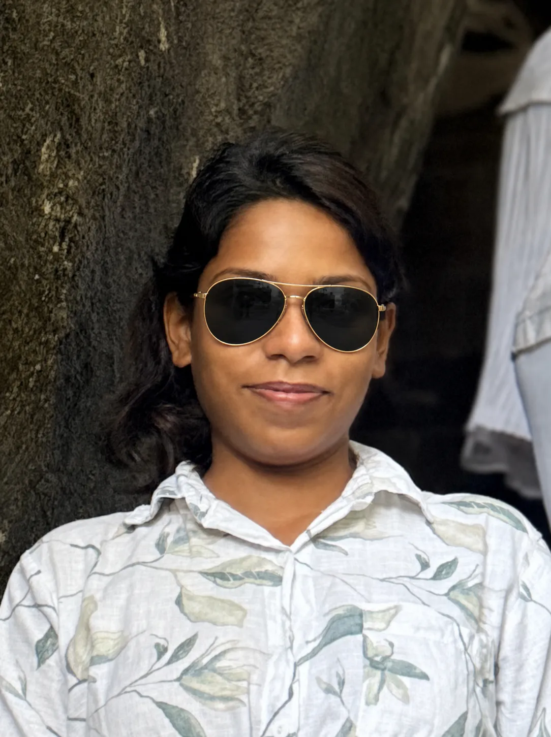 Try this sunglasses on the lady in the photo in the most natural way possible.
